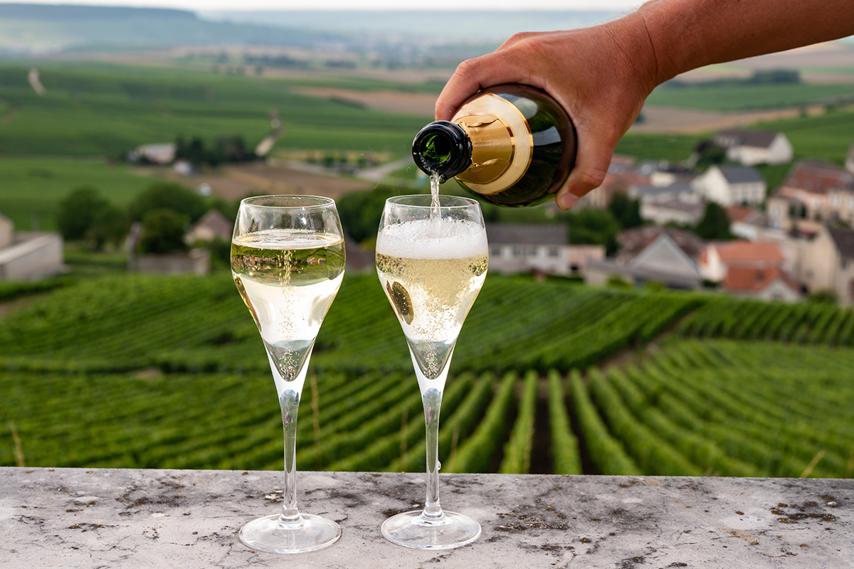 Two glasses of sparkling wine being poured in France